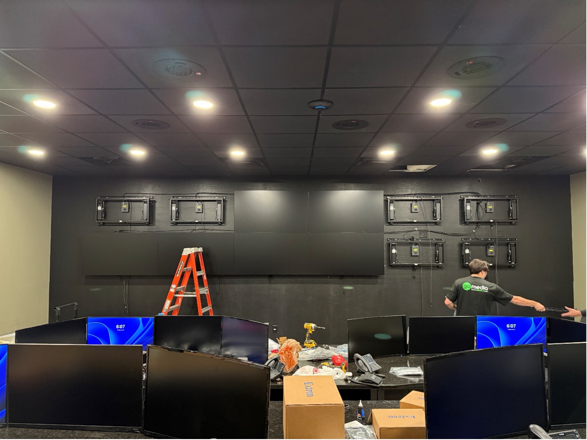 Go Media technicians installing video wall displays in a real-time crime center