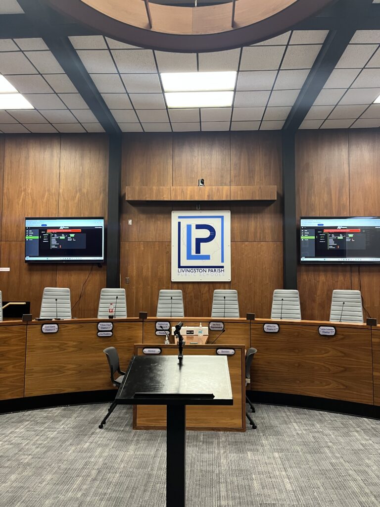 Livingston Parish Public Schools boardroom with displays microphones and AV system