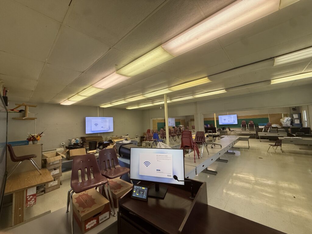 School classroom with presentation displays microphone and AV control system