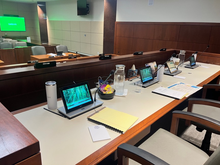 Council chamber equipped with delegate microphones and voting displays