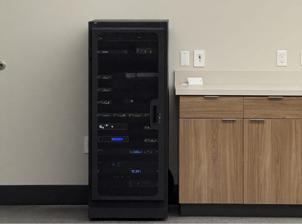 AV equipment rack supporting a real-time crime center technology system